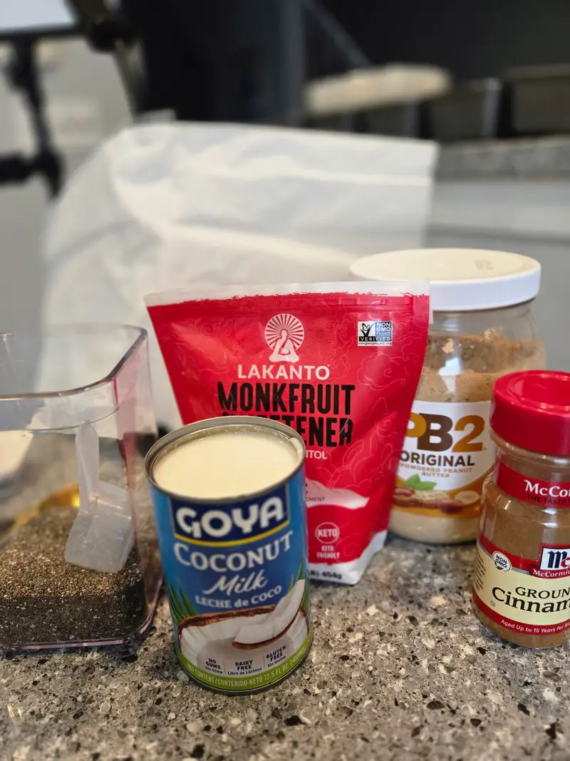 The ingredients laid out: coconut milk, monkfruit sweetener, PB2 and cinnamon