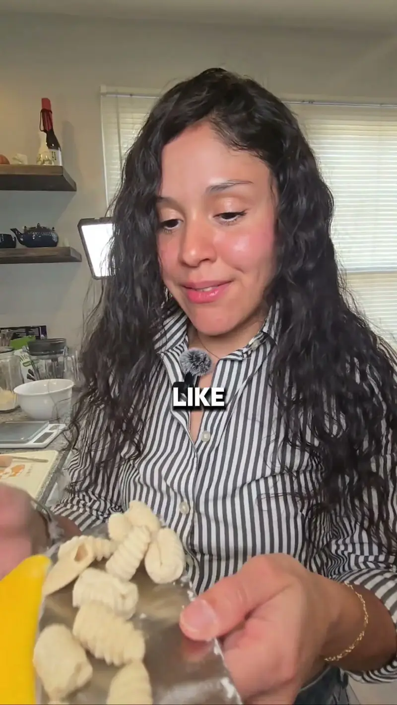 Hands holding a handful of freshly cut two-ingredient pasta